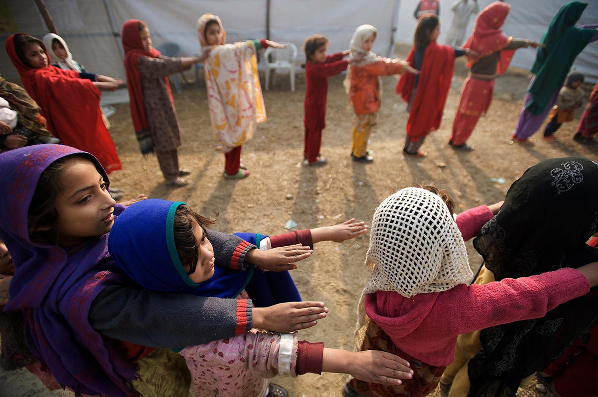 Schoolgirls perform their daily exercises in Charsadda District, northern Pakistan (UNICEF/Shehzad Noorani).