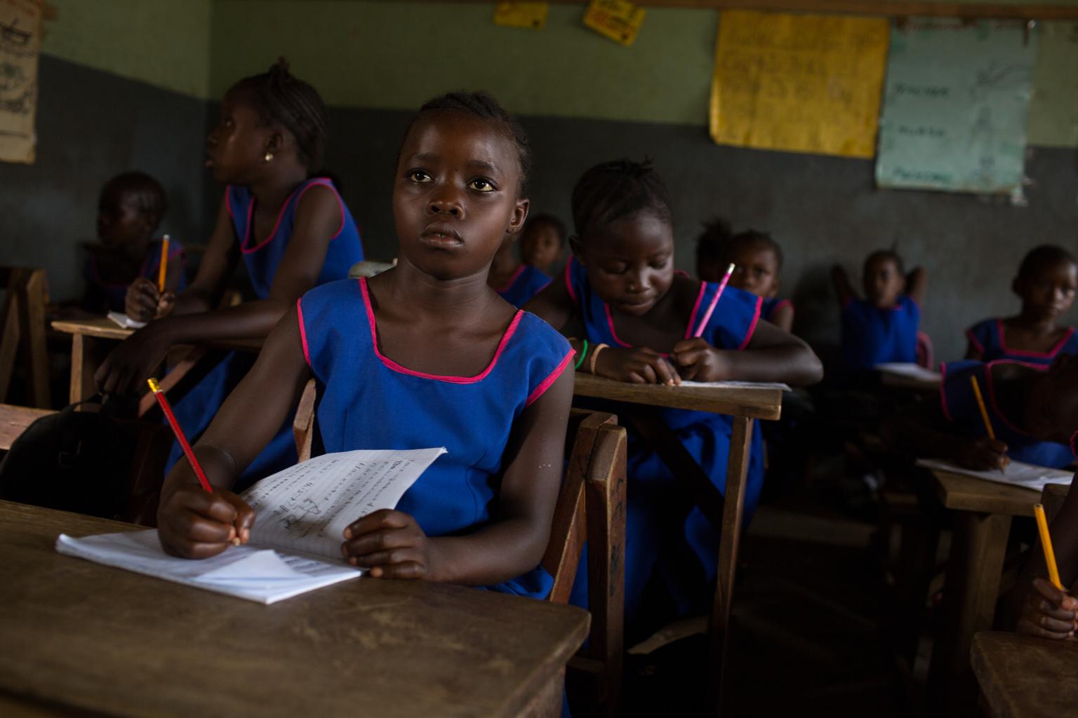 Secondary schoolgirls take notes in the Bombali district of northern Sierra Leone (UNICEF/Tanya Bindra).